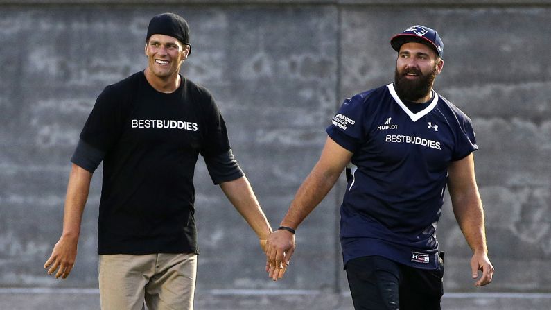 Tom Brady, left, and New England teammate Rob Ninkovich walk together after playing in a Best Buddies charity football game Friday, May 29, in Boston.