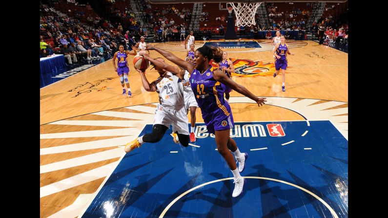 Jantel Lavender of the Los Angeles Sparks defends Alyssa Thomas of the Connecticut Sun during a WNBA preseason game in Uncasville, Connecticut, on Thursday, May 28.