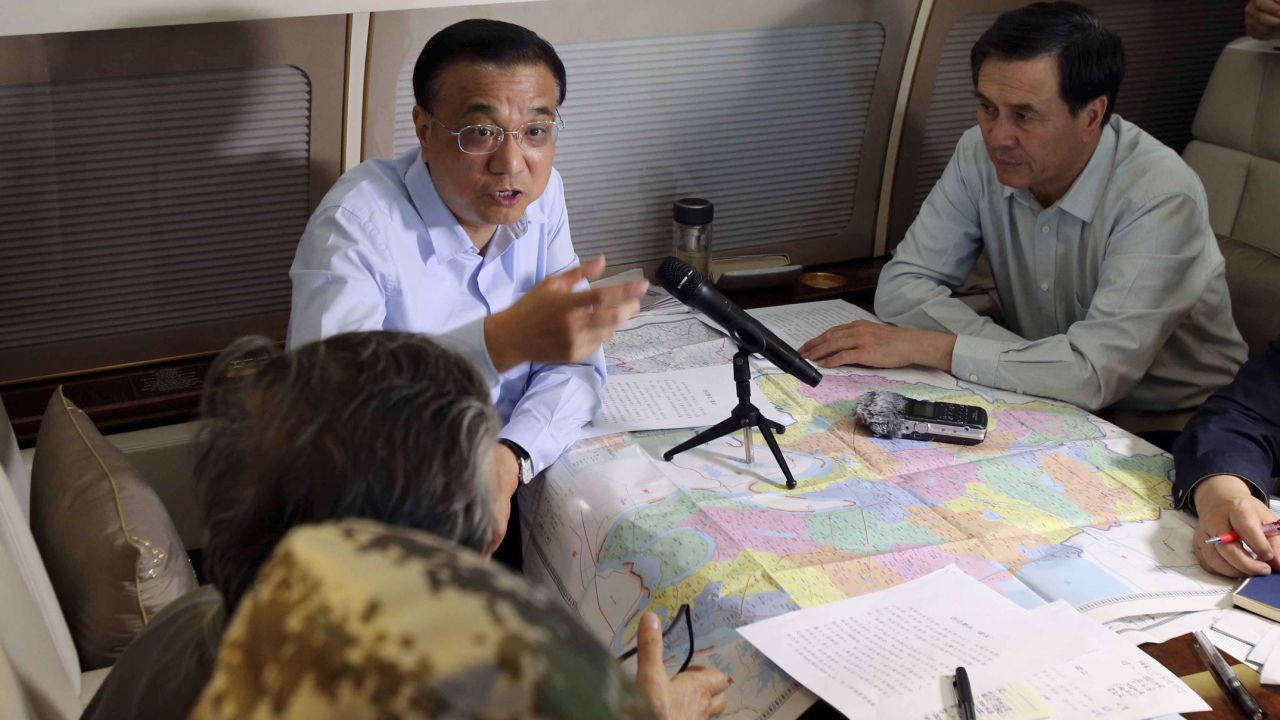 Chinese Premier Li Keqiang speaks aboard a plane en route to the ship on June 2.
