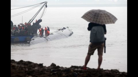 A man watches rescue efforts on June 2.