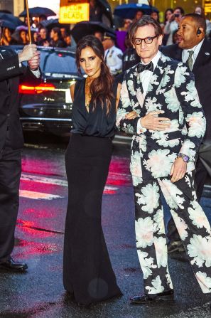 Former Spice Girl turned fashion designer, Victoria Beckham, also opted for a figure-hugging number.<br />She's pictured here alongside English fashion journalist, Hamish Bowles -- hardly your shrinking violet in this flamboyant floral suit.