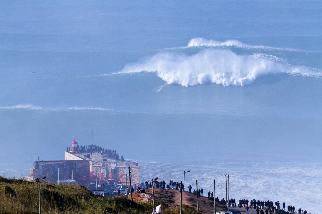 Cotton, a mere speck in the distance, gained global notoriety in late 2013 when he tackled a wave in Portugal estimated to be between 60-80 feet.
