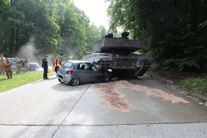 A teenage driver collides with a military vehicle in Berlin, Germany on June 1, 2015.