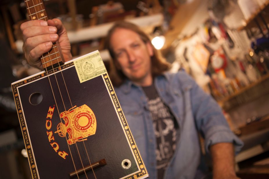 Each guitar is handcrafted and no two are alike. Snowden holds up a three-string electric guitar made with a Punch cigar box, maple inlay and walnut fretboard. "There's some kind of magic going on in the box. I don't know what it is. It doesn't sound like a banjo. It doesn't sound like a guitar. It's hard to describe," Snowden said. "A bigger box has more of a deep tone. A smaller box has a tighter tone."