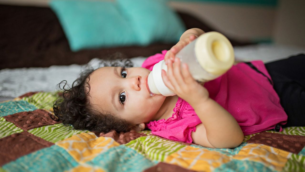 "I've heard people say 'There's no bonding in this photo,' but Rachel, she is a spitfire," Whitman said of one baby she photographed self-feeding with a bottle. "Even at that small, she's very independent."
