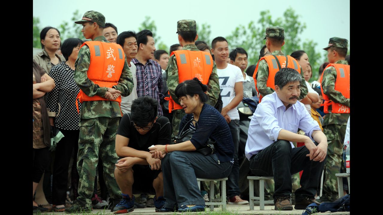Relatives of passengers await news in Jingzhou, China, on June 3.