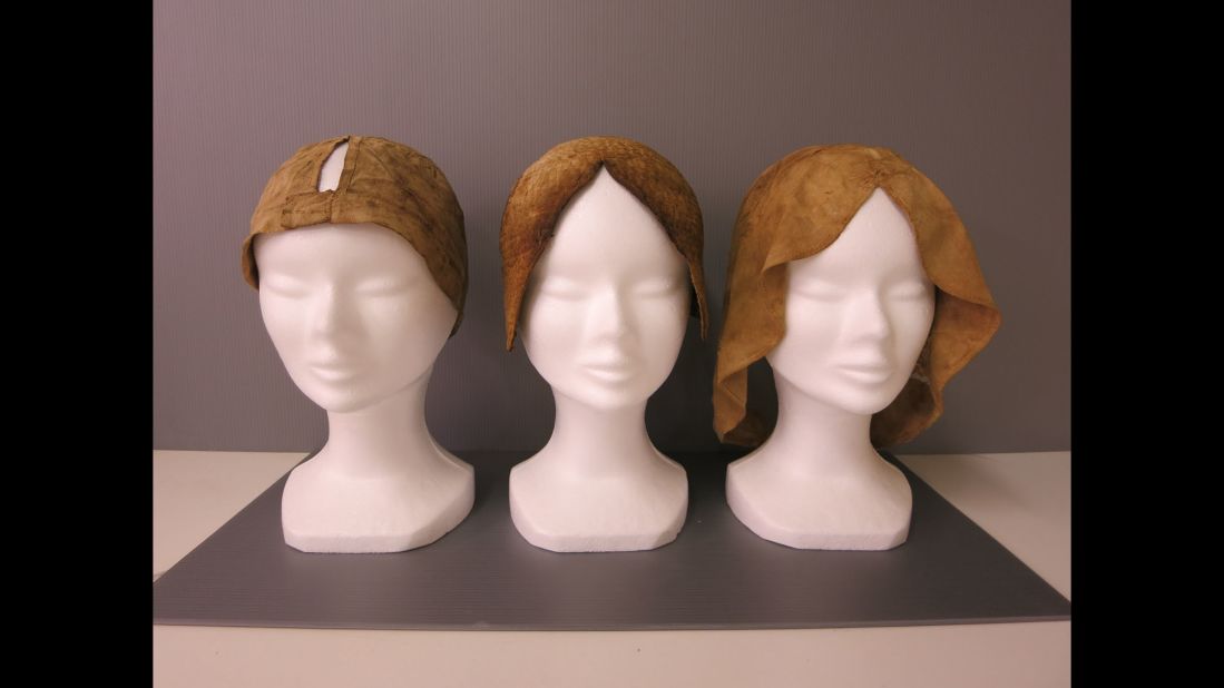Restored bonnets belonging to de Quengo are on display. The corpse will be reburied once scientists finish all their testing.