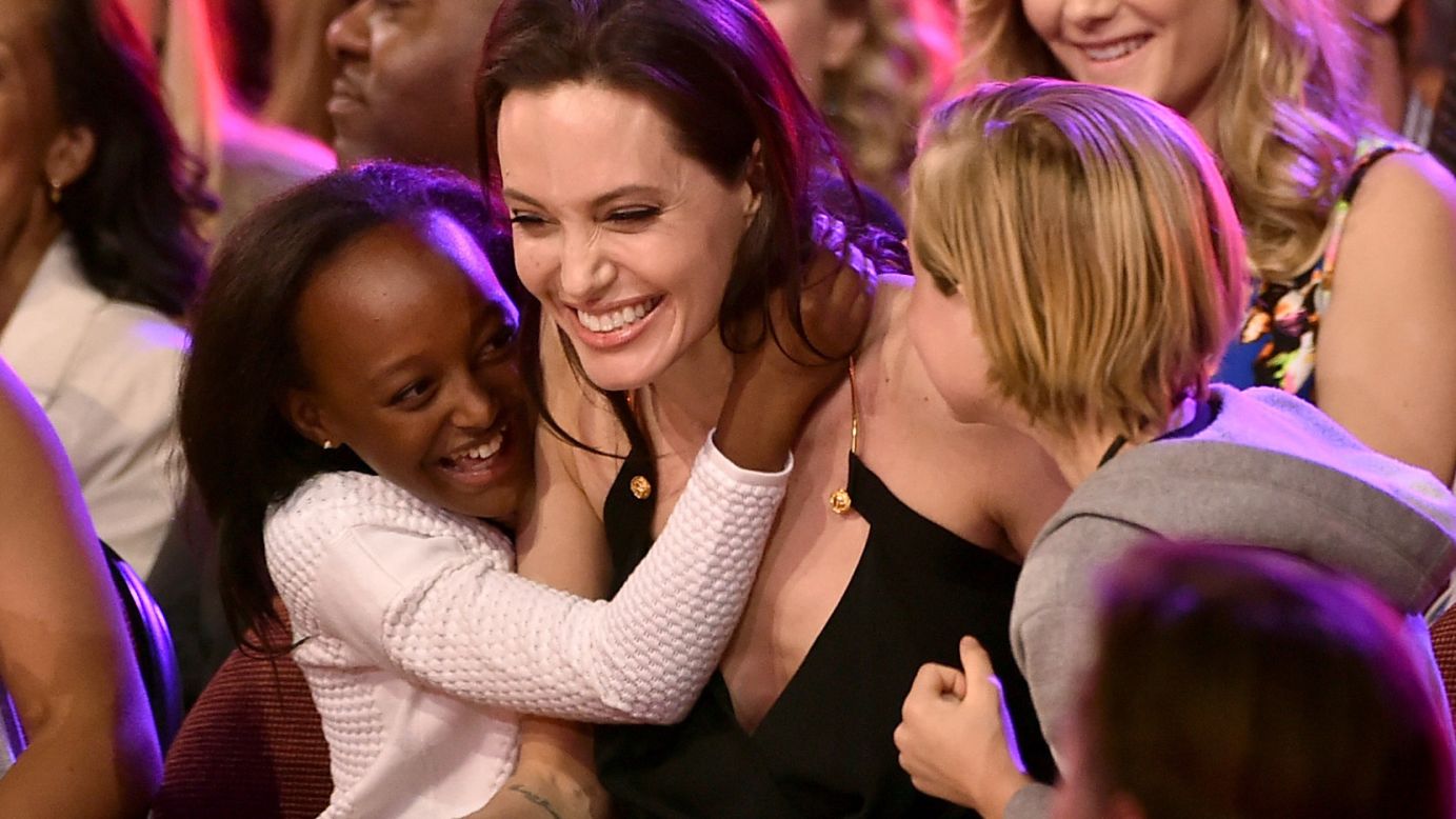 Jolie hugs her children Zahara, left, and Shiloh after winning an award during Nickelodeon's Kids' Choice Awards in March 2015. Jolie won Favorite Villain for her role in "Maleficent."