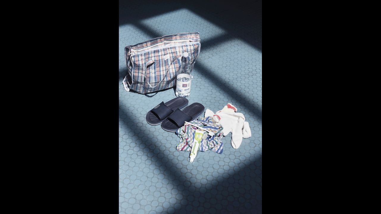 Upon arriving at the reception center in Pozzallo, migrants are provided with a welcome package that includes a tracksuit, a pair of sandals and a white plastic wristband with an identification number for the Italian immigration system.