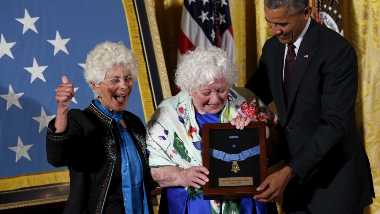 Ina Bass gives a thumbs-up as her sister Elsie Shemin-Roth accepts the Medal of Honor from U.S. President Barack Obama during a ceremony at the White House on Tuesday, June 2. The women accepted the award on behalf of their late father, Army Sgt. William Shemin. Shemin <a href="http://www.cnn.com/2015/05/15/politics/medal-of-honor/index.html" target="_blank">was posthumously awarded the medal</a> for his actions in combat during World War I.