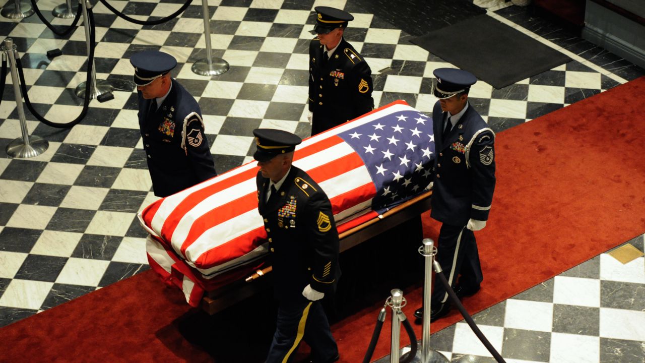 An honor guard carries Biden's casket out of  Legislative Hall in Dover, Delaware.