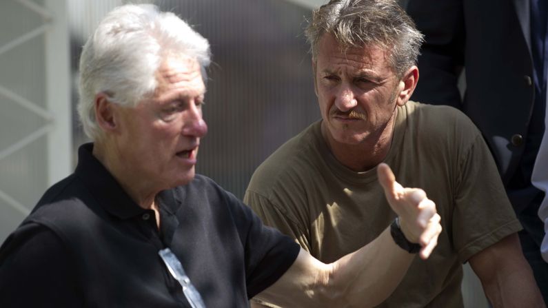 Clinton and actor Sean Penn visit a cholera treatment center in Port-au-Prince, Haiti, in February 2015.