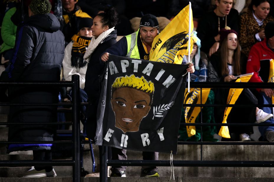 A Hurricanes fan holds a banner in memory of Collins during the Super Rugby match between the Hurricanes and the Highlanders. He played for the club between 2001 and 2008.