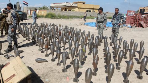 Iraqi police with ISIS ammunition found after Al-Alam town was recaptured in March 2015.