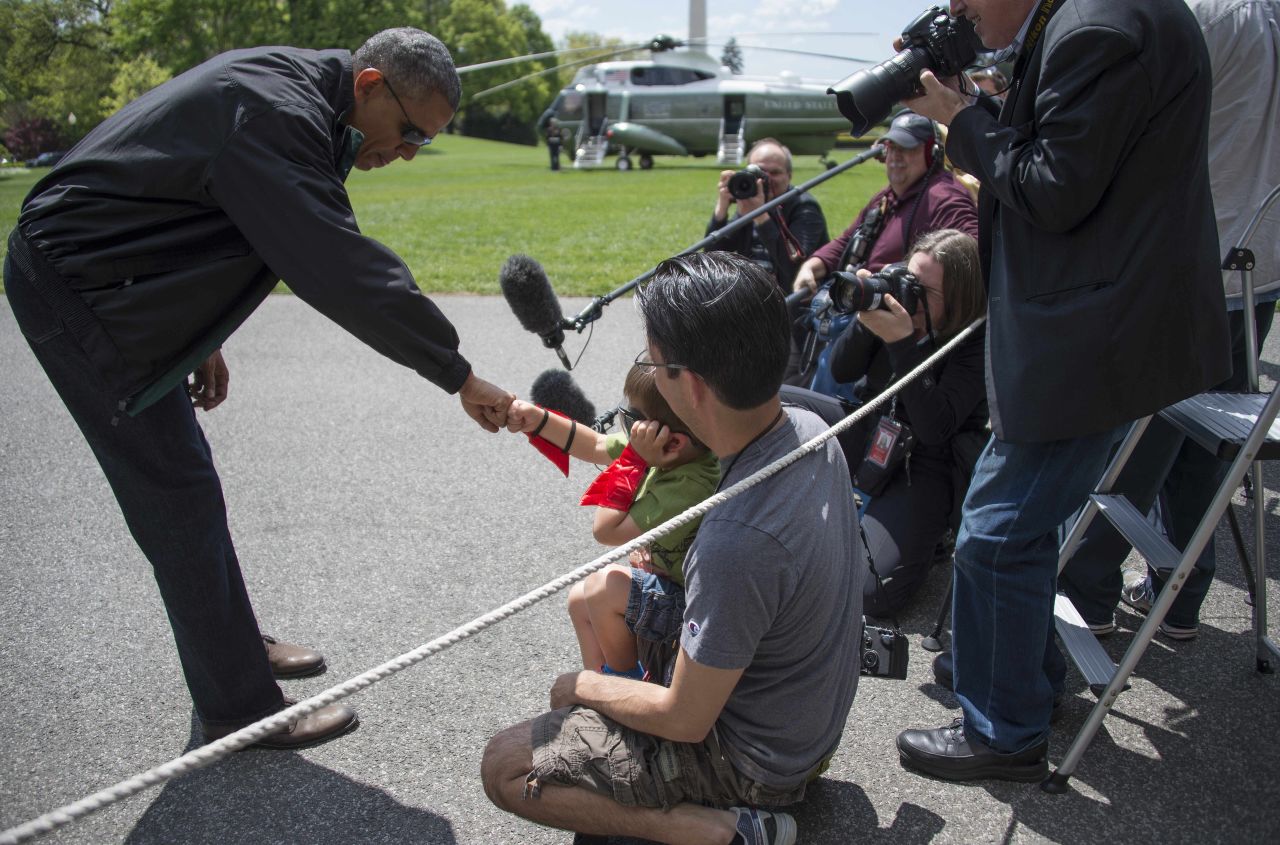 As he departs the White House in May, Obama fist bumps with 4-year-old Luca Martinez, who is wearing a superhero costume.