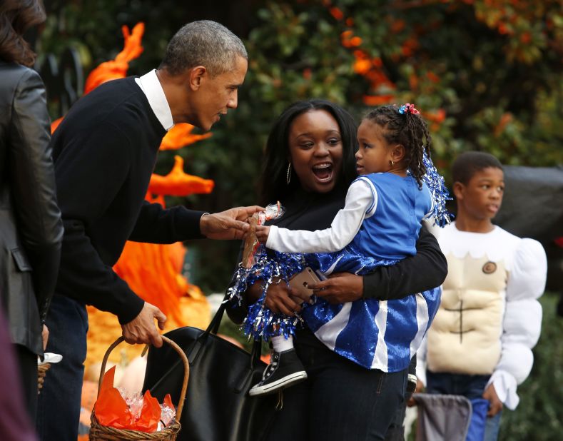 Obama greets trick-or-treaters at the White House in October 2014.