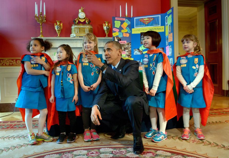 Obama poses with a Girl Scout Daisy troop from Tulsa, Oklahoma, during the White House Science Fair in March.