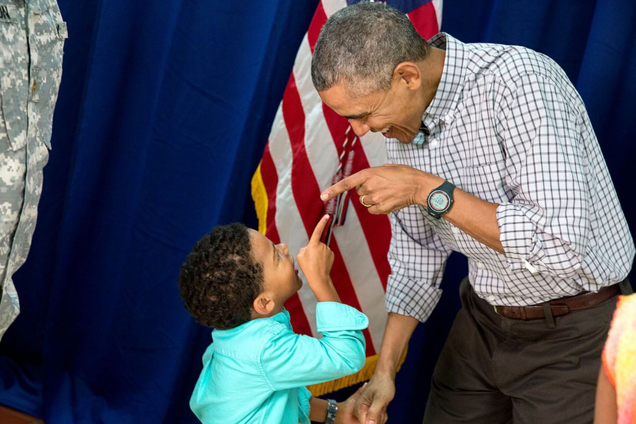 Obama and a young boy point at each other at Marine Corps Base Hawaii on Christmas Day.