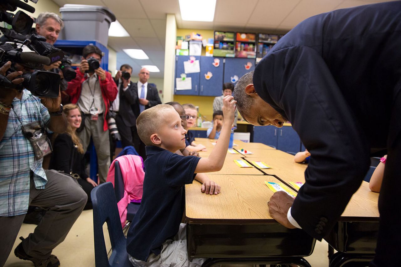 Obama allows first-grader Edwin Caleb to touch his hair during a classroom visit at Clarence Tinker Elementary School at MacDill Air Force Base in Tampa, Florida, in September.