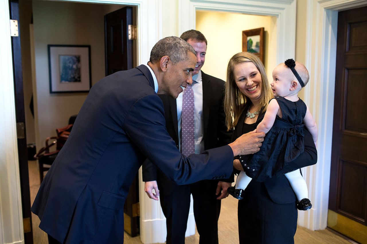 Obama greets departing staff member Lindsay Hayes and her family in September.