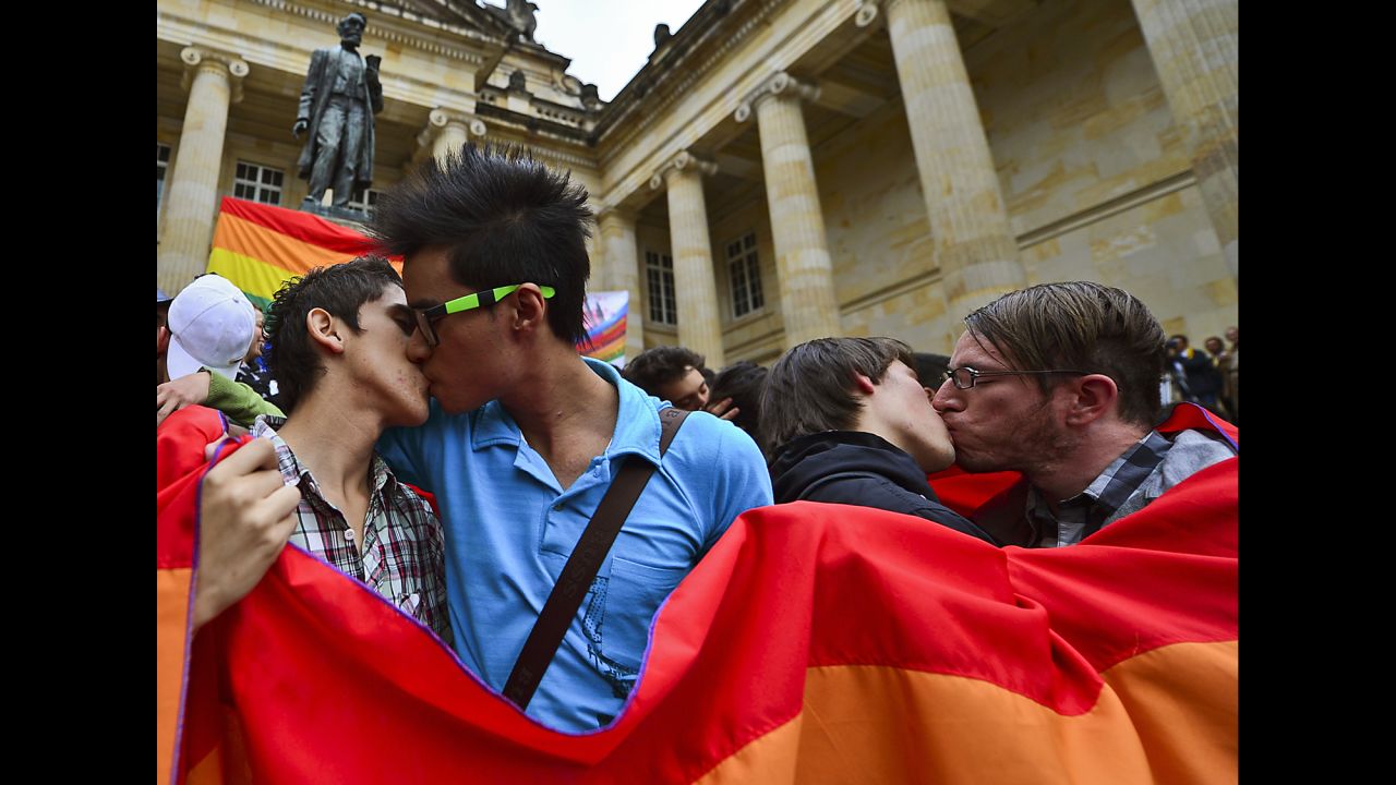 Same-sex couples kiss during a protest by the LGBT community at the Bolivar Square in Bogota,Colombia, in November 2012.