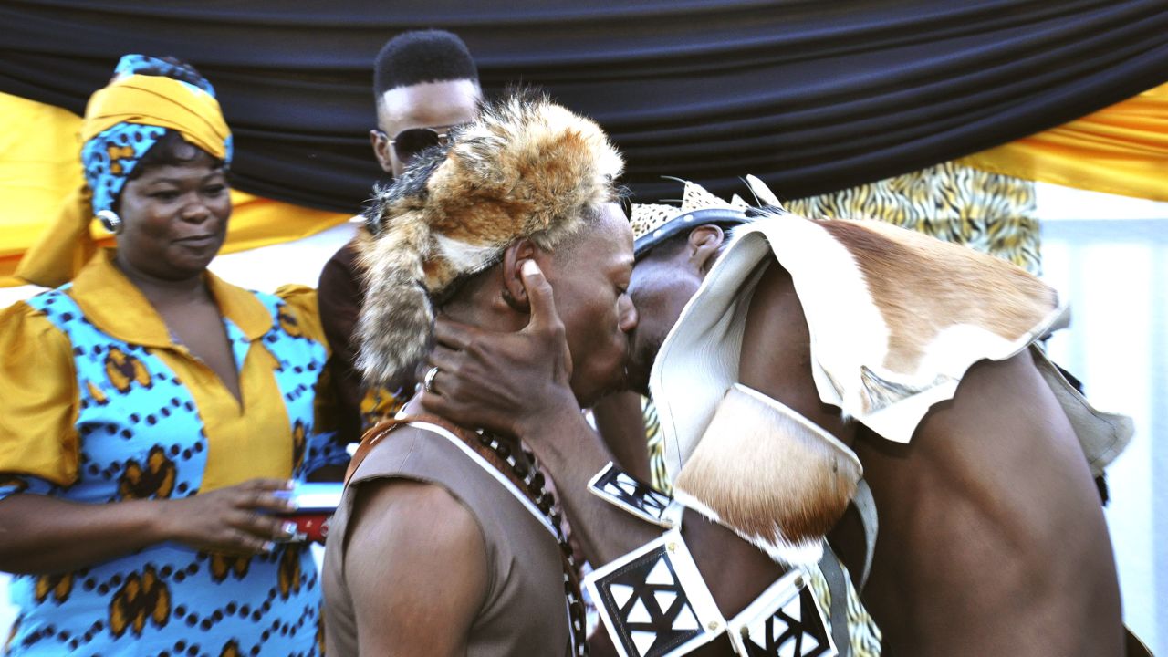 Tshepo Modisane and Thobajobe Sithole kiss at their wedding at Siva Sungum Hall in Kwadukuza, South Africa in April, 2013.