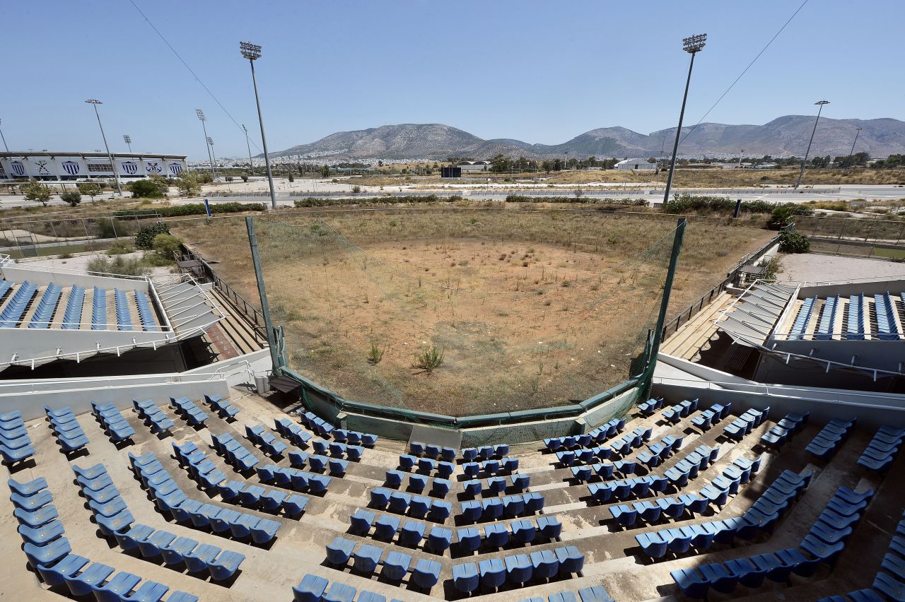 The softball stadium built for the 2004 Athens Olympics is an example of facility wastage post-global tournaments. The cost of hosting the Olympics was estimated at €9 billion, with the majority of sporting venues built specifically for the games. Due to Greece's post-Olympic economic frailties, the majority of the newly constructed stadiums now lie abandoned. 