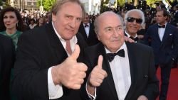 French actor Gerard Depardieu (L) and FIFA President Sepp Blatter give a thumbs-up as they arrive for the screening of the film 'United Passions' at the 67th edition of the Cannes Film Festival in Cannes.