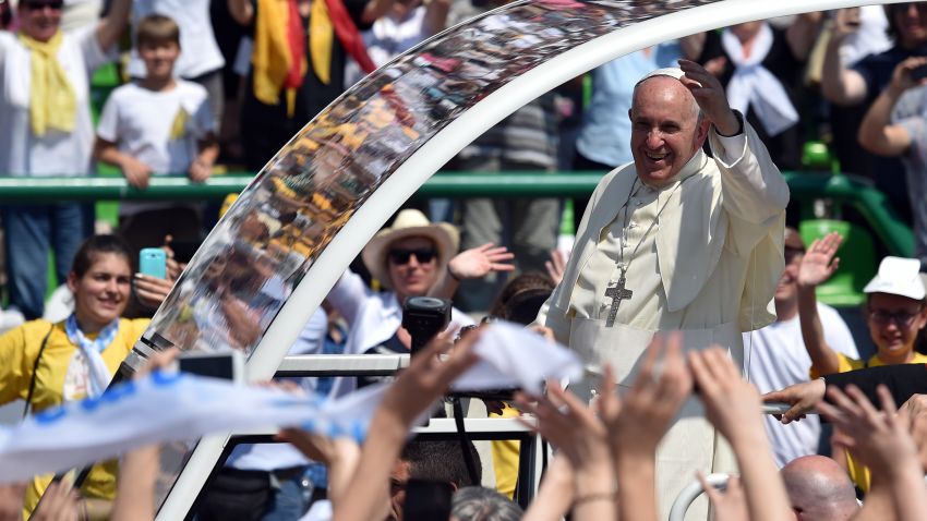 Pope Francis gives his blessing from his popemobile as he arrives to celebrate Mass at Sarajevo's city stadium Saturday. on June 6, 2015. Pope Francis arrived in Sarajevo for a visit aimed at bolstering reconciliation between war-scarred Bosnia's Serb, Croat and Muslim communities. The trip comes 20 years after the end of a 1992-95 conflict that ripped the Balkan state apart and left it permanently divided along ethnic lines. AFP PHOTO / ANDREJ ISAKOVIC (Photo credit should read ANDREJ ISAKOVIC/AFP/Getty Images)