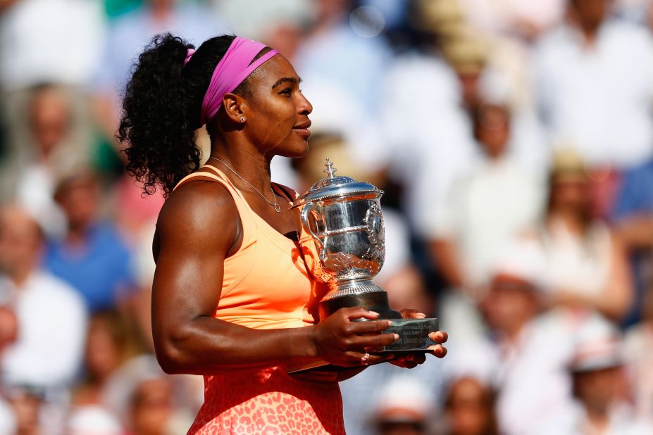 Serena Williams poses on court after triumphing in the 2015 French Open final.