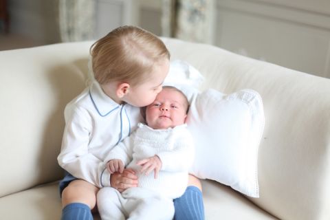 Princess Charlotte is seen with her big brother for the first time in a photo released by Kensington Palace in June 2015.