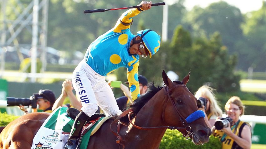 ELMONT, NY - JUNE 06:  Victor Espinoza, celebrates atop American Pharoah #5, after winning the 147th running of the Belmont Stakes at Belmont Park on June 6, 2015 in Elmont, New York. With the wins American Pharoah becomes the first horse to win the Triple Crown in 37 years.  (Photo by Al Bello/Getty Images)
