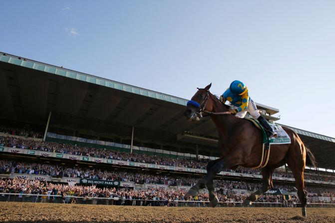 Victor Espinoza looks back after crossing the finish line.