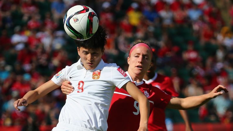 Canada's Josee Belanger, right, defends Wang Shanshan of China.