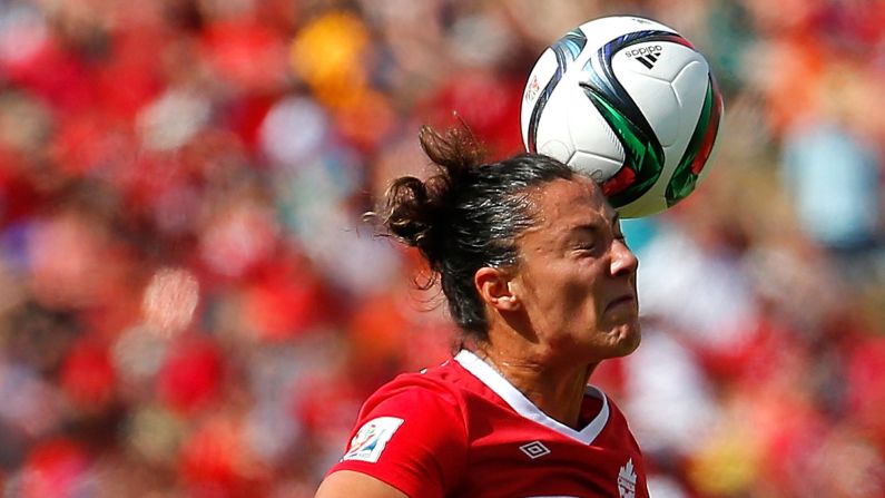 Canada's Melissa Tancredi wins a header.