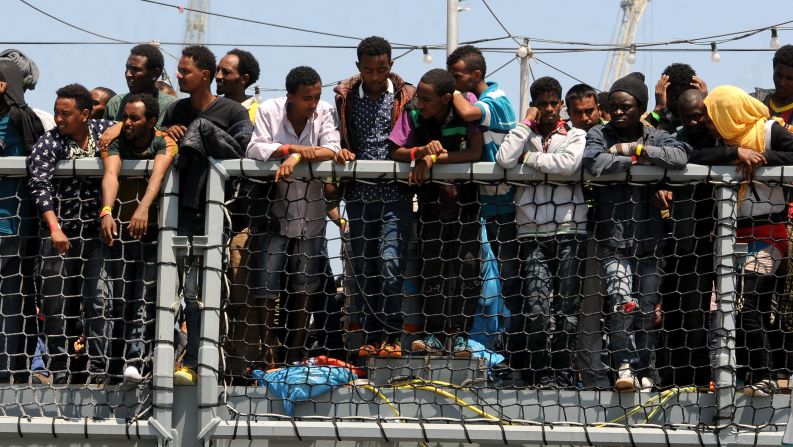 Migrants wait to disembark from the German navy ship Hessen in Palermo, Italy, on Sunday, June 7. European rescue boats are bringing <a href="index.php?page=&url=http%3A%2F%2Fwww.cnn.com%2F2015%2F06%2F07%2Feurope%2Fmediterranean-migrants-rescue%2Findex.html">thousands of migrants</a> to safety as they try to cross the Mediterranean Sea. There has been <a href="index.php?page=&url=http%3A%2F%2Fwww.cnn.com%2F2015%2F04%2F21%2Feurope%2Fmediterranean-boat-migrants-lister%2Findex.html">a surge</a> in the number of migrants making the dangerous journey toward Europe's shores.