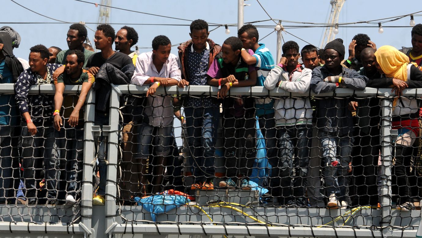 Migrants wait to disembark from the German navy ship Hessen in Palermo, Italy, on Sunday, June 7. European rescue boats are bringing <a href="http://www.cnn.com/2015/06/07/europe/mediterranean-migrants-rescue/index.html">thousands of migrants</a> to safety as they try to cross the Mediterranean Sea. There has been <a href="http://www.cnn.com/2015/04/21/europe/mediterranean-boat-migrants-lister/index.html">a surge</a> in the number of migrants making the dangerous journey toward Europe's shores.