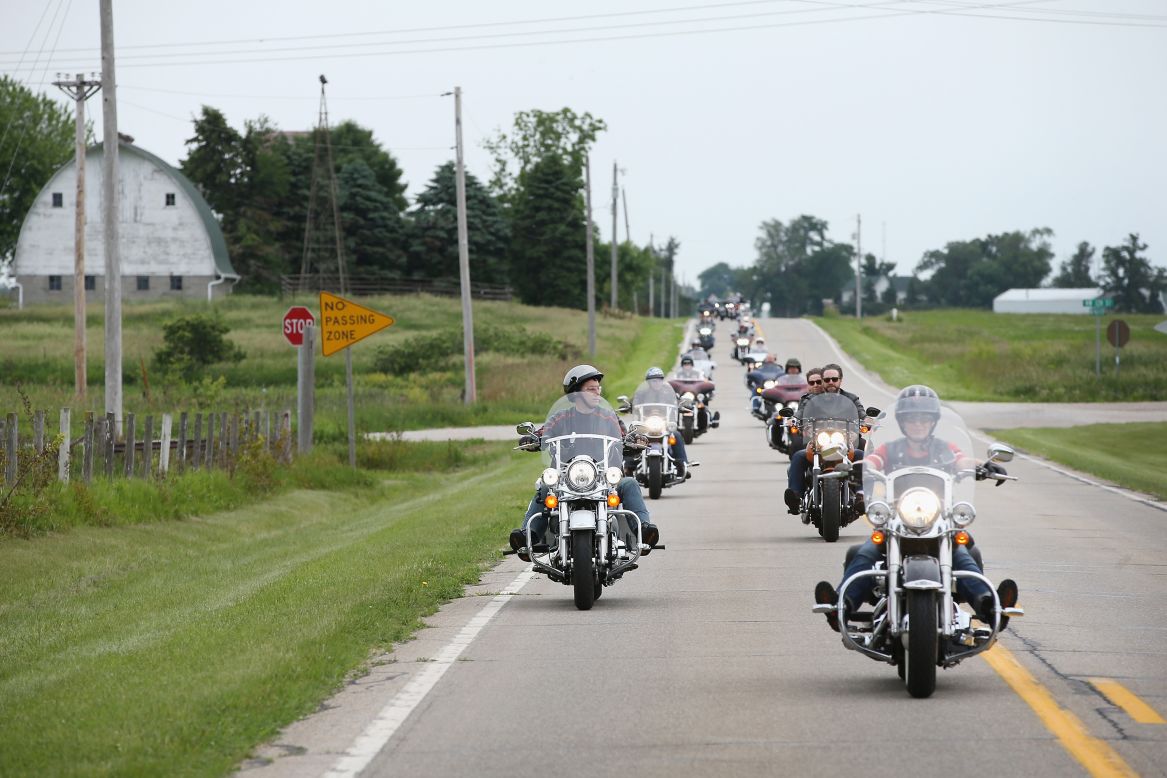 Wisconsin Gov. Scott Walker and freshman Sen. Joni Ernst, R-Iowa, lead a group of bikers during a Roast and Ride hosted by Ernst on Saturday, June 6, in Boone, Iowa. Ernst is hoping the event, which featured a motorcycle tour, a pig roast and speeches from several 2016 presidential hopefuls, becomes an Iowa Republican tradition.  