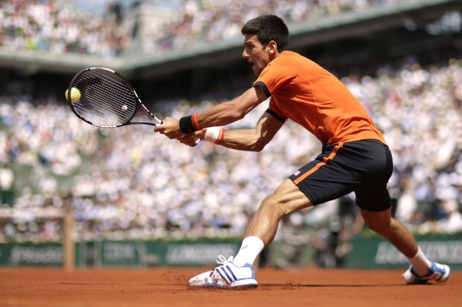 Djokovic powers a backhand as he took the opening set of his final against Wawrinka in Paris.