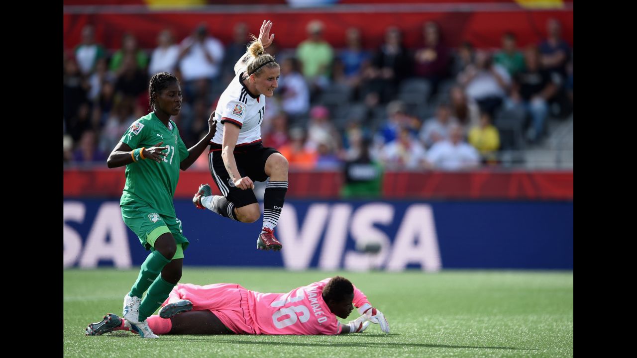 Germany's Anja Mittag, top, reacts while scoring the sixth goal of the match. 