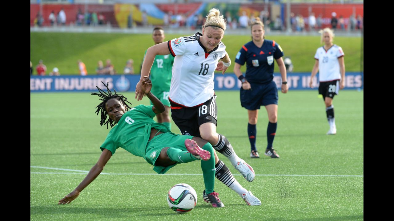 Ivory Coast midfielder Rita Akaffou, left, battles Germany forward Alexandra Popp in the second half of the match. 