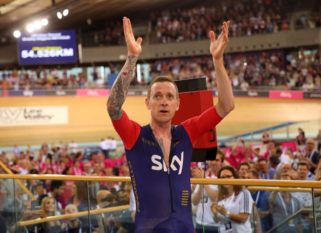 Wiggins celebrates setting a new world hour record in front of a capacity crowd at London's Olympic velodrome in 2015. 
