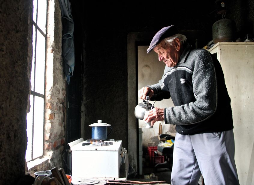 Novak prepares maté, a beverage infusion of bitter dried leaves. Though the caffeine-rich drink is traditionally shared with others, Novak says he's used to being alone in this ghost village.