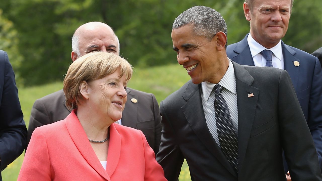 Merkel and Obama chat while posing for a group photo on Monday, June 8, the second day of the summit of G7 nations.