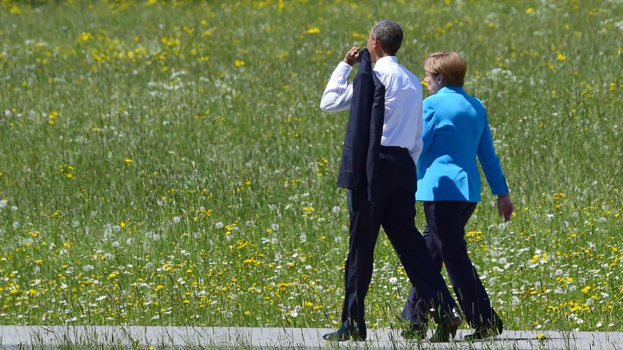 Obama and Merkel walk on their way to their first working session at Elmau Castle on June 7.