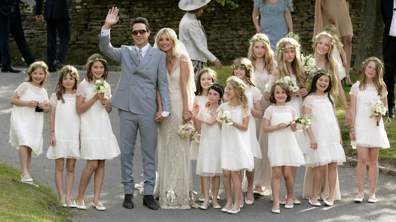 Rock star Jamie Hince and Moss pose for photographs after their wedding in July 2011.