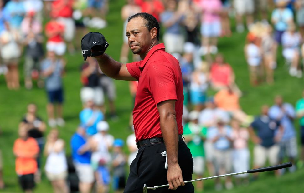 Tiger Woods acknowledges the crowd on the 18th hole at the 2015 Memorial Tournament, where he carded the worst round of his professional career while also recording his highest ever aggregate total.