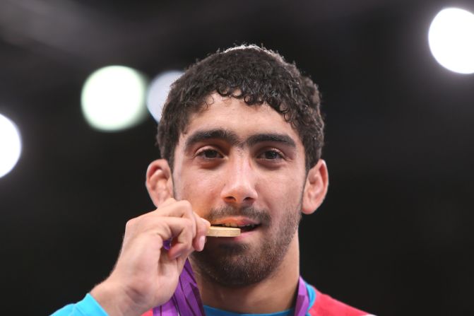 Taste of success: Toghrul Asgarov claimed gold for Azerbaijan in the men's 60kg freestyle event at the 2012 London Olympics.