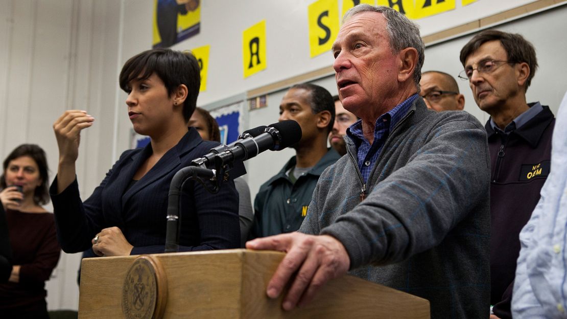 Lydia Callis helps then-Mayor Michael Bloomberg warn New Yorkers about Superstorm Sandy in October 2012.