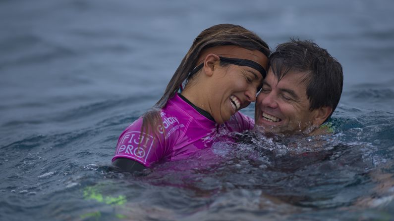 Pro surfer Sally Fitzgibbons celebrates with her father, Martin, after winning an event in Tavarua, Fiji, on Thursday, June 4.